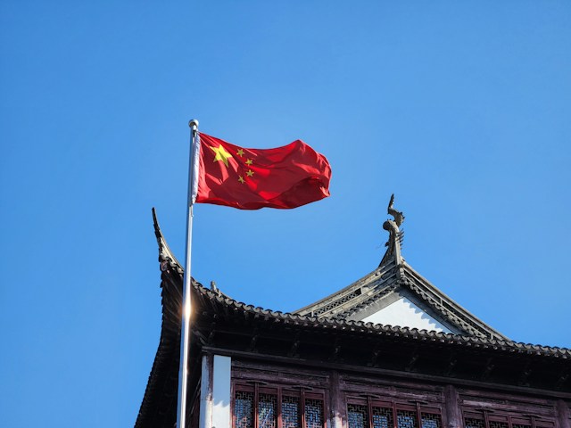 Chinese flag flying on building