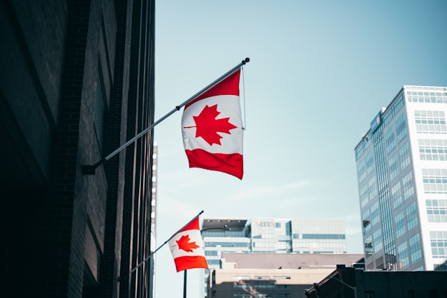 Canadian flags flying from office buildings