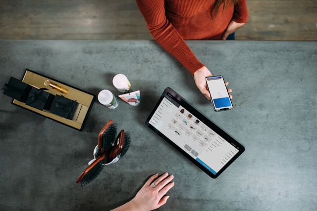 person using phone to pay for cosmetics