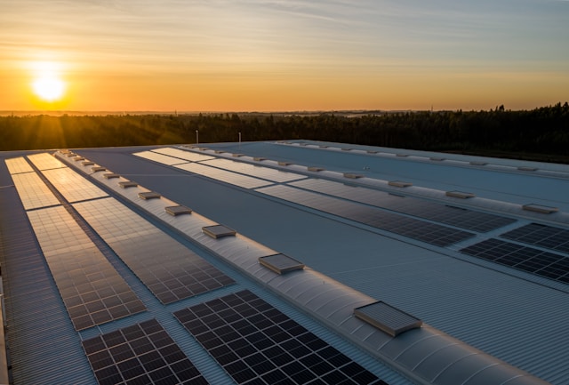 solar panels on a roof with sun shining