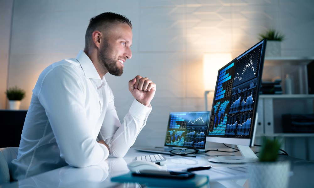 man with victory fist raise and computer