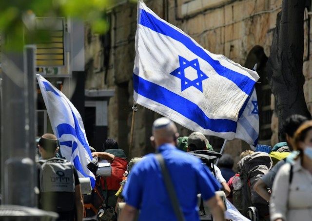 People holding Israeli flags in Jerusalem